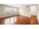 A bright living room features large windows with natural light and hardwood floors at 2355 Henderson Mill Ne Rd # 6, Atlanta, GA 30345