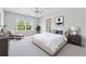 Spacious bedroom with a large window, comfortable seating, and a modern design at 3134 Flery Way, Lawrenceville, GA 30046