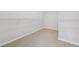 Walk-in closet features carpet flooring, wire shelving and ample storage space at 3134 Flery Way, Lawrenceville, GA 30046