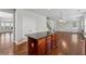 Spacious kitchen with an island, wood cabinetry and floors, perfect for cooking and entertaining at 3134 Flery Way, Lawrenceville, GA 30046