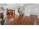Expansive living area with hardwood floors, fireplace, open kitchen, and staircase for seamless living at 3134 Flery Way, Lawrenceville, GA 30046