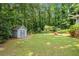 Large backyard with shed, swing set and play area offers ample space for outdoor enjoyment at 4371 N Park Dr, Tucker, GA 30084