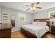 Relaxing bedroom with hardwood floors, neutral decor, and plenty of natural light at 4371 N Park Dr, Tucker, GA 30084