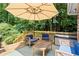 Relax on the deck with comfortable seating and a view of the lush backyard at 4371 N Park Dr, Tucker, GA 30084