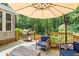 Outdoor deck featuring a grill and comfortable seating, perfect for entertaining at 4371 N Park Dr, Tucker, GA 30084