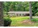 Charming brick home with well-manicured lawn and covered parking at 4371 N Park Dr, Tucker, GA 30084