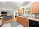 Bright kitchen with wood cabinets, window view, and open to the living room at 4371 N Park Dr, Tucker, GA 30084