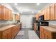Spacious kitchen featuring wood cabinets, stainless steel appliances, and ample counter space at 4371 N Park Dr, Tucker, GA 30084