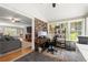 Bright sunroom with desk, multiple windows and view to living room at 4371 N Park Dr, Tucker, GA 30084