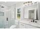 Modern bathroom featuring shower, granite countertop vanity, and black hardware at 4539 Braselton Hwy, Hoschton, GA 30548