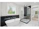 Elegant bathroom features freestanding tub, glass shower, and marble accents, creating a luxurious and relaxing space at 4539 Braselton Hwy, Hoschton, GA 30548