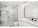 Modern bathroom featuring shower, granite countertop vanity, and black hardware at 4539 Braselton Hwy, Hoschton, GA 30548