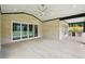 Large covered patio featuring outdoor kitchen, ceiling fan, and sliding glass doors at 4539 Braselton Hwy, Hoschton, GA 30548