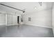 Garage with clean epoxy flooring, ample space, and a separate storage area at 4539 Braselton Hwy, Hoschton, GA 30548