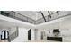 Open-concept living area with high ceilings connects the living room and kitchen at 4539 Braselton Hwy, Hoschton, GA 30548