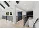 Hallway featuring hardwood floors, black railings, and coffered ceilings at 4539 Braselton Hwy, Hoschton, GA 30548