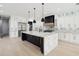 Modern kitchen with a large island, marble countertops, and stainless steel appliances at 4539 Braselton Hwy, Hoschton, GA 30548