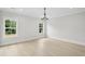 Bright living room with hardwood floors, natural light, and modern chandelier for a calm and inviting atmosphere at 4539 Braselton Hwy, Hoschton, GA 30548