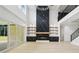 Bright living room with fireplace feature, hardwood floors, and walls of windows at 4539 Braselton Hwy, Hoschton, GA 30548