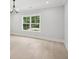 Bright living room with hardwood floors, natural light, and calming paint tones for a serene atmosphere at 4539 Braselton Hwy, Hoschton, GA 30548