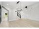 Open-concept living room featuring hardwood floors, modern lighting, and decorative walls at 4539 Braselton Hwy, Hoschton, GA 30548