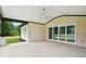 Covered patio with an outdoor fan, offering plenty of room for outdoor living and entertaining at 4539 Braselton Hwy, Hoschton, GA 30548