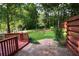 Inviting deck and patio area lead to a large backyard with a storage shed, blending outdoor living and storage at 5152 Suggs St, Powder Springs, GA 30127