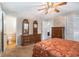 Bedroom showing a detailed dresser, coordinating nightstands, and access to bathroom at 5152 Suggs St, Powder Springs, GA 30127