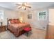 Bedroom features a comfortable bed, patterned bedding, and matching nightstands at 5152 Suggs St, Powder Springs, GA 30127