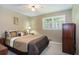 Comfortable bedroom with ceiling fan, carpeted floor, and natural light at 5152 Suggs St, Powder Springs, GA 30127