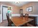 Comfortable dining area featuring a wooden table, classic furnishings, and a view into the kitchen at 5152 Suggs St, Powder Springs, GA 30127