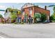 Corner view of a commercial brick building, featuring storefronts and street parking at 5152 Suggs St, Powder Springs, GA 30127