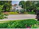 Elegant historic home with manicured front lawn and wraparound porch at 5152 Suggs St, Powder Springs, GA 30127