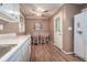 Cozy kitchen with eat-in area, white cabinets and appliances at 5152 Suggs St, Powder Springs, GA 30127