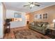 Inviting living room featuring wood floors, a sofa, and decorative accents at 5152 Suggs St, Powder Springs, GA 30127