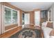 Cozy living room featuring hardwood floors, a neutral color palette, and large windows for natural light at 5152 Suggs St, Powder Springs, GA 30127