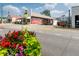 Intersection view with the historic 'Rooted Trading Co.' Coca-Cola mural adding character to the area at 5152 Suggs St, Powder Springs, GA 30127