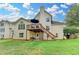 Expansive backyard with multi-level deck and lush lawn is perfect for outdoor entertaining at 708 Edgeley Ln, Lawrenceville, GA 30044
