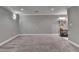 Large basement with plush gray carpet and recessed lighting at 708 Edgeley Ln, Lawrenceville, GA 30044