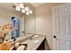 Cozy bathroom with granite countertop and a decorative vase and soap collection at 708 Edgeley Ln, Lawrenceville, GA 30044