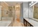 Bright bathroom with a large glass shower, soaking tub, and marble countertops at 708 Edgeley Ln, Lawrenceville, GA 30044