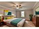 Bedroom features hardwood floors and a large window overlooking the backyard at 708 Edgeley Ln, Lawrenceville, GA 30044