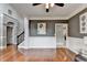 Open hallway featuring hardwood floors and access to multiple rooms at 708 Edgeley Ln, Lawrenceville, GA 30044