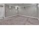 Spacious living room features neutral-toned walls and carpet and is ready for personalization at 708 Edgeley Ln, Lawrenceville, GA 30044