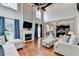 Bright living room with fireplace, hardwood floors, and soaring ceilings at 708 Edgeley Ln, Lawrenceville, GA 30044