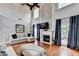 Inviting living room featuring a fireplace, hardwood floors, and plenty of seating at 708 Edgeley Ln, Lawrenceville, GA 30044