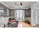 Bright living room featuring hardwood flooring and natural light from a large window at 708 Edgeley Ln, Lawrenceville, GA 30044