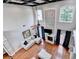 Open-concept living room with tall ceilings, hardwood floors, and a cozy fireplace at 708 Edgeley Ln, Lawrenceville, GA 30044