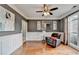 Cozy living room with chair, hardwood flooring, and natural light from a large window at 708 Edgeley Ln, Lawrenceville, GA 30044