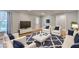 Staged living room featuring hardwood floors, white furniture, and modern decor at 708 Edgeley Ln, Lawrenceville, GA 30044